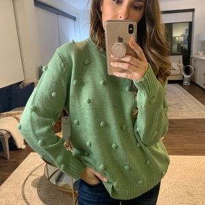 Green pom sweater